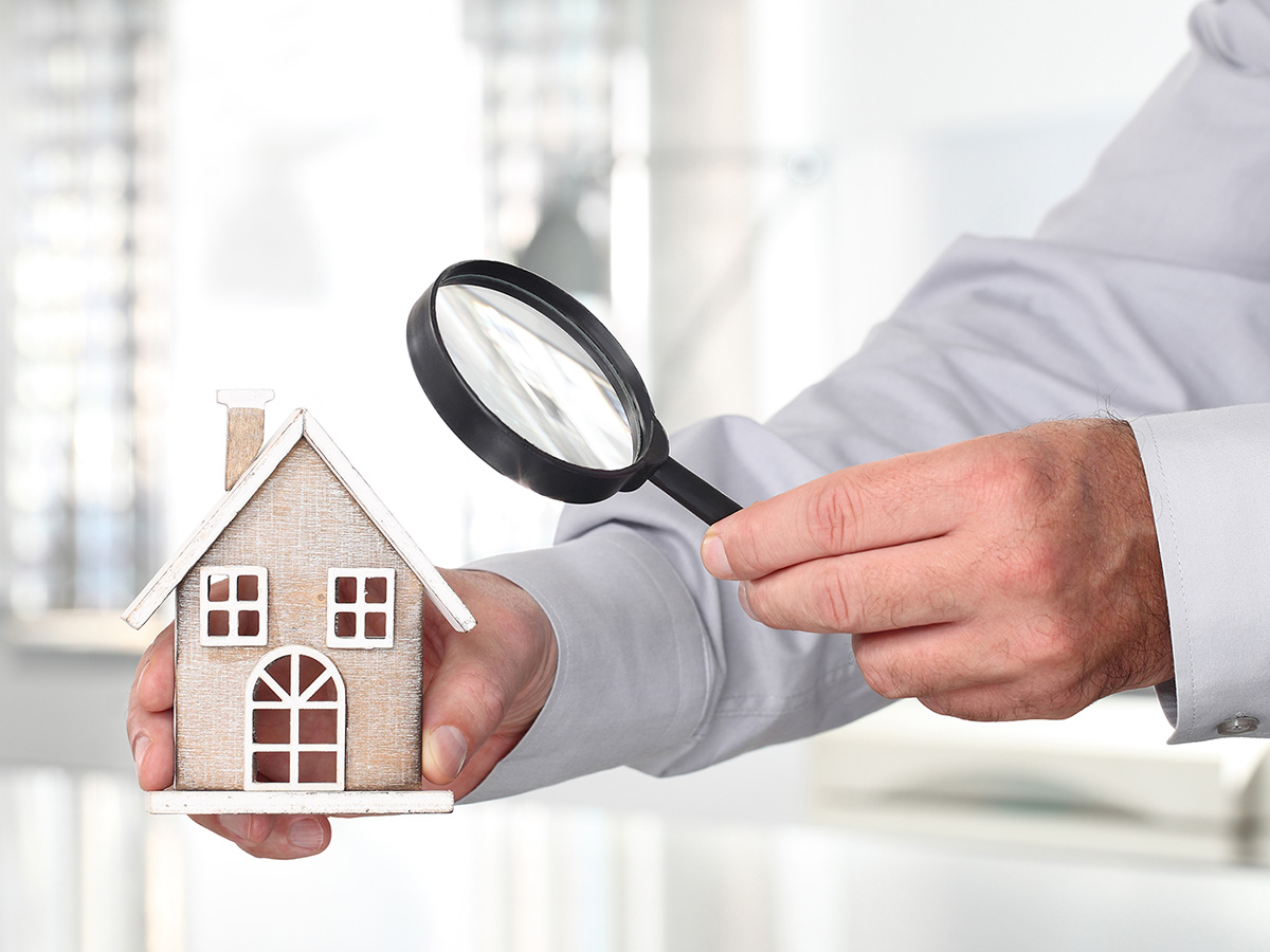house with magnifying glass