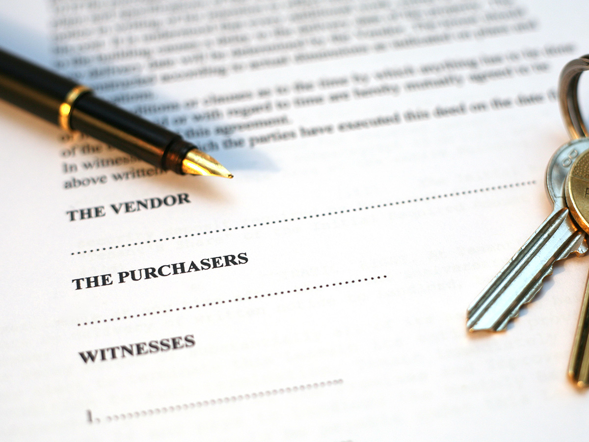 pen and keys on loan agreement