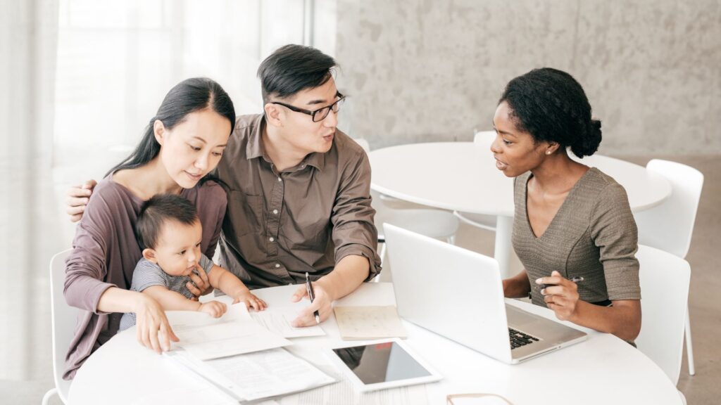 family working with real estate agent