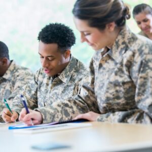 military members sign paperwork