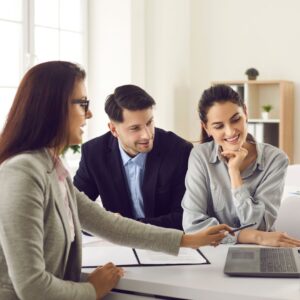 couple meeting with a relocation specialist