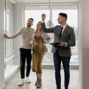 A real estate agent showing a house to a couple