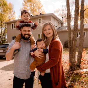 young family outside home