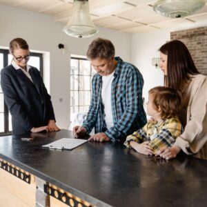 family with real estate agent