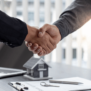 Realtor shaking hands with a customer