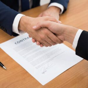 shaking hands over contract