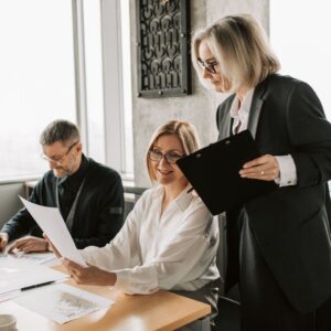 coworkers sharing information in office